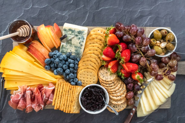 istock Gourmet cheese, crackers, and fruit 1293162476