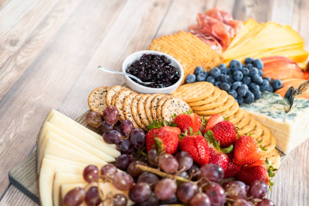 istock Gourmet cheese, crackers, and fruit 1293162570