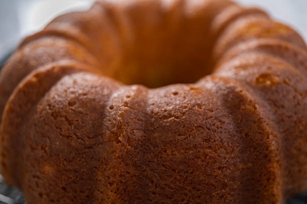 istock Cooling lemon bundt cake on a kitchen drying rack. 1293163311