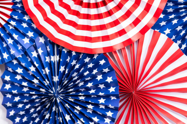 istock Red, white, and blue paper fans for July 4th celebration. 1293163336