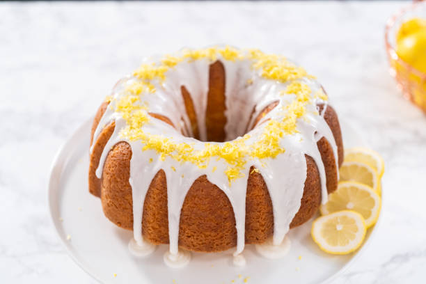 istock Lemon bundt cake decorated with lemon zest on a cake stand. 1293163345