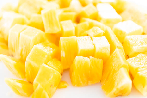 istock Cleaning and cutting a pineapple into the small pieces. 1293163384