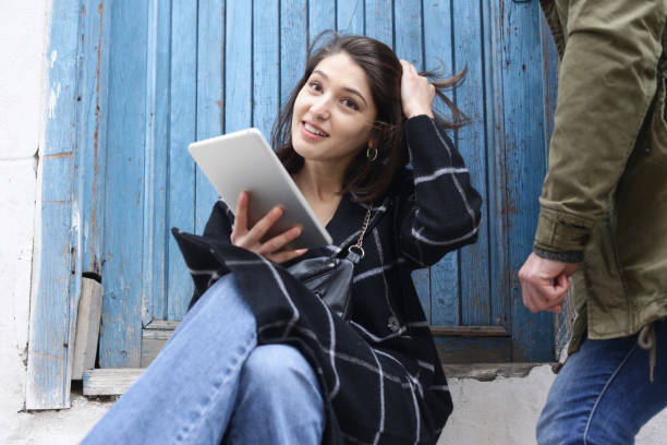 istock young couple is freelance e-learning on the street 1293164345