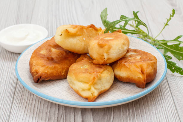 istock Plate with fried pies on wooden boards. 1293164443