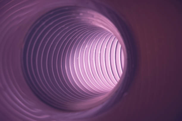 istock Beautiful round abstract pink tunnel with color light on a background pattern textured ford design. 1293166227
