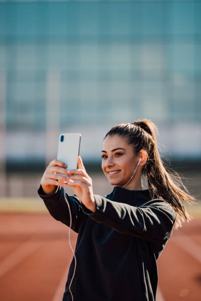 istock Smiling face, posing, having earphones on. 1293167438