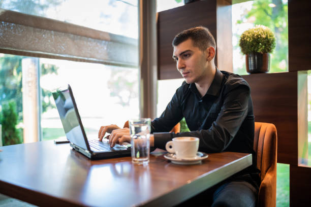 istock Young business man in coffee shop 1293170700