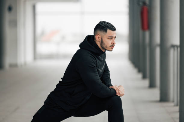 istock Male stretching legs before leg day training. 1293172867