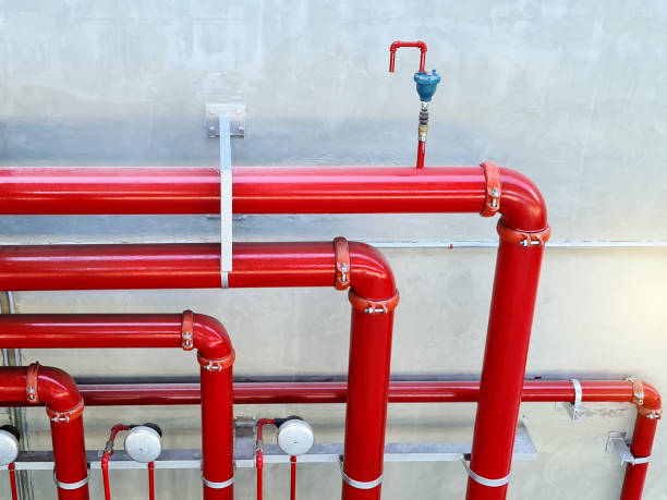 istock High Angle View of Red Fire Water Piping System Against Wall 1293172918