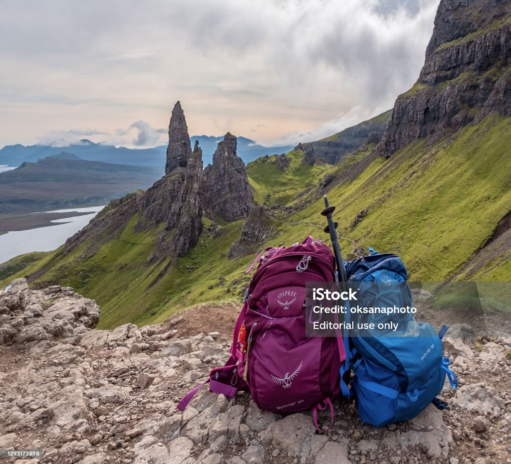 Isle of Skye Isle of Skye, Scotland: two backpacks resting on the ground after the hike to Old Man of Storr Osprey Stock Photo