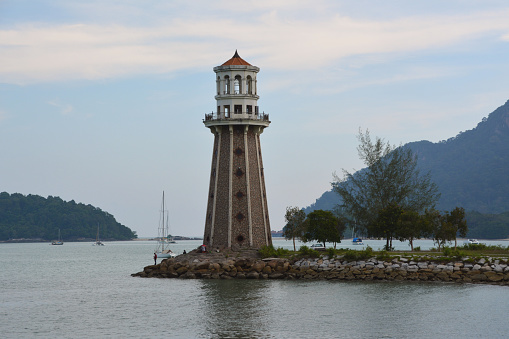 Perdana Quay Lighthouse watching the bay at Telaga harbour park in Pulau Langkawi island, Malaysia.
