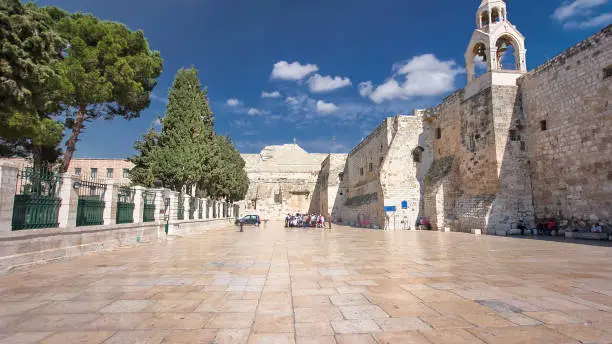 The Church of the Nativity of Jesus Christ timelapse hyperlapse. Palestin. The city of Bethlehem. Entrance and exit. Blue cloudy sky