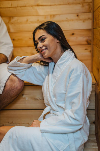 istock Young woman sitting in the sauna and relaxing 1293178921