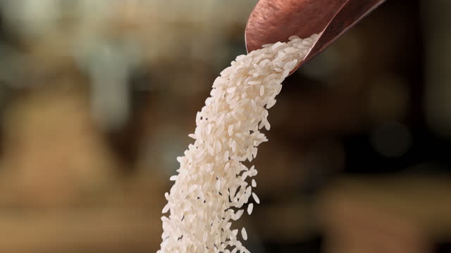 rice pouring from a scoop