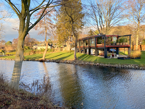 Villa with a lake view in Holte designed by the famous Danish architect Jørn Utzon. The photo was taken in Holte, a suburb north of Copenhagen, Christmas day, 2020.