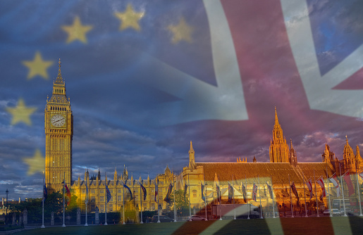 BREXIT conceptual image with flags of United Kingdom and European Union over a image of London.