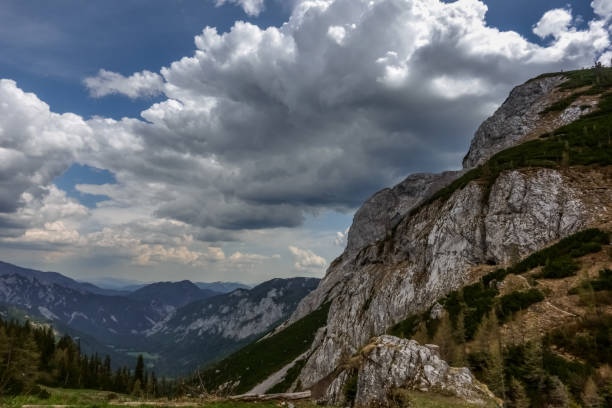 istock nice rocks and mountains with wide view and white clouds 1293184634
