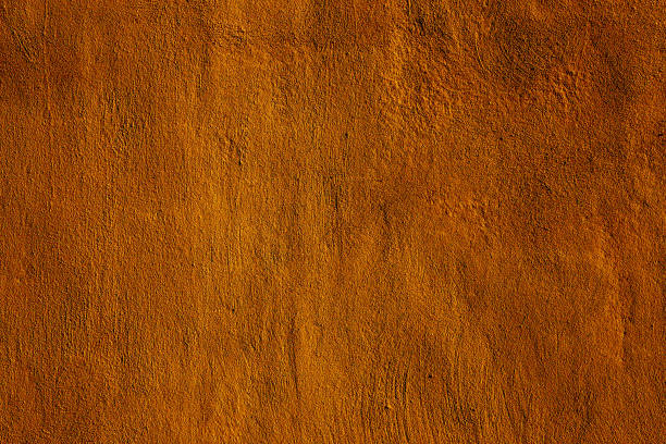 istock Copper colored wall texture background with textures of different shades of copper or bronze 1293184779