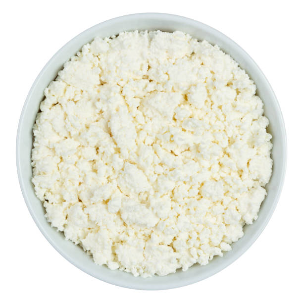 istock Skim cheese in a white cup isolated on white background 1293187158