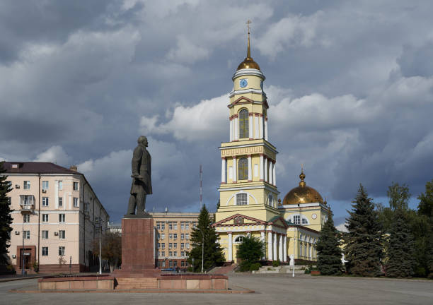 Lipetsk, Russia - August 16, 2020: Sobornaya Ploshchad square, monument to Vladimir lenin and Khristo-Rozhdestvenskiy Kafedral'nyy Sobor cathedral on the right