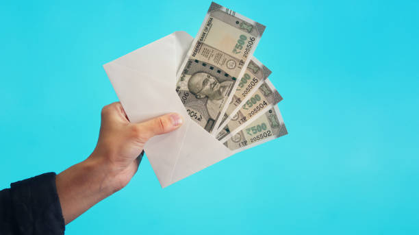 Envelope full of 500 Indian banknotes stock photo