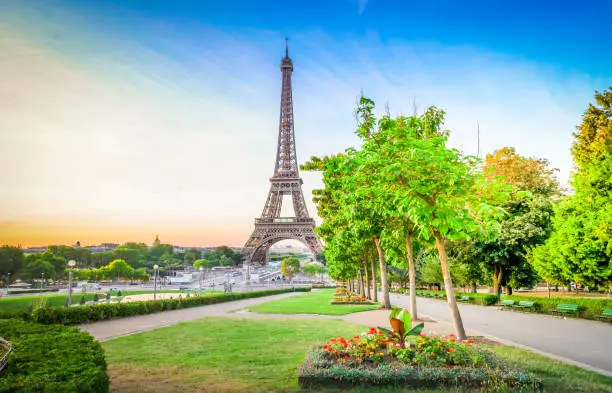 Paris Eiffel Tower and Trocadero garden at sunrise in Paris, France. Web banner format. Eiffel Tower is one of the most iconic landmarks of Paris at early morning
