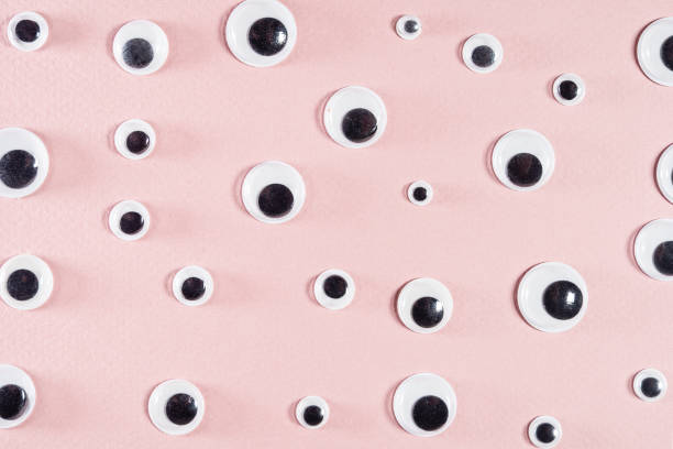 istock self-adhesive flat plastic doll eyes on pink paper 1293191263