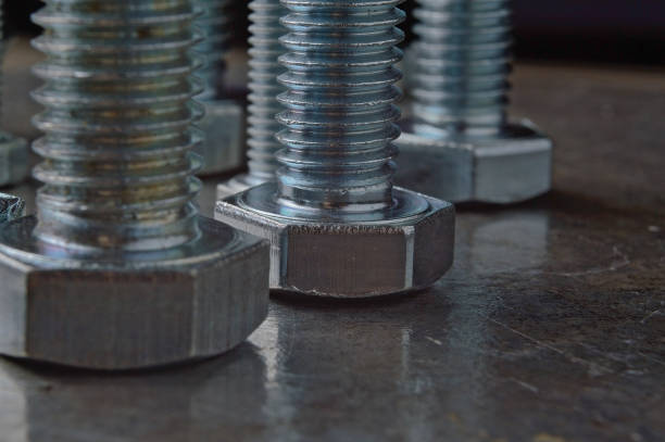 istock Bolts of various sizes laid out on a metal surface. assorted closeups. 1293194466