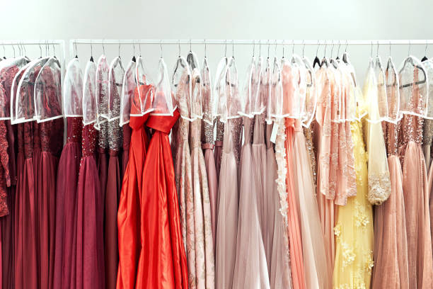 istock Various dresses in different colors on hangers in a rental service 1293196671