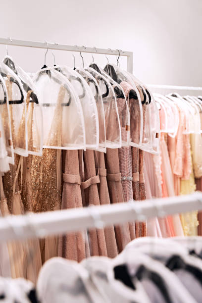 istock Various dresses in different colors on hangers in a rental service 1293196674