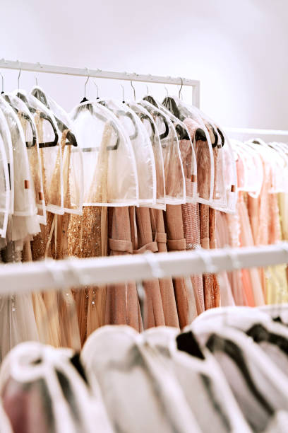 istock Various dresses in different colors on hangers in a rental service 1293196682