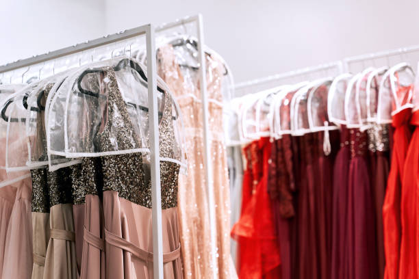 istock Various dresses in different colors on hangers in a rental service 1293196685