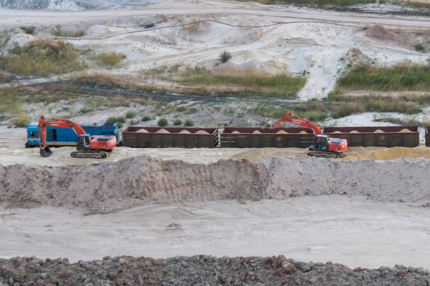 istock Loading of sand by excavators into railway cars 1293197619