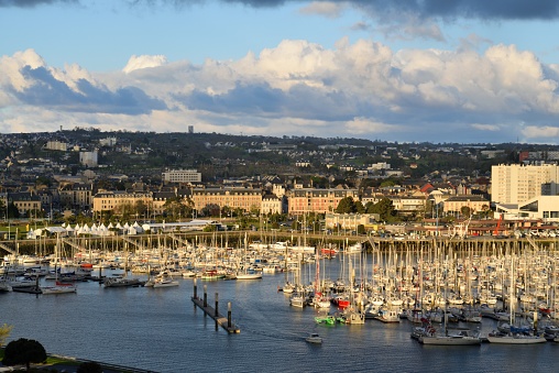 Sailboats everywhere in the Cherbourg, France marina as our cruise ship glides into port under a cloudscape of cumulus clouds