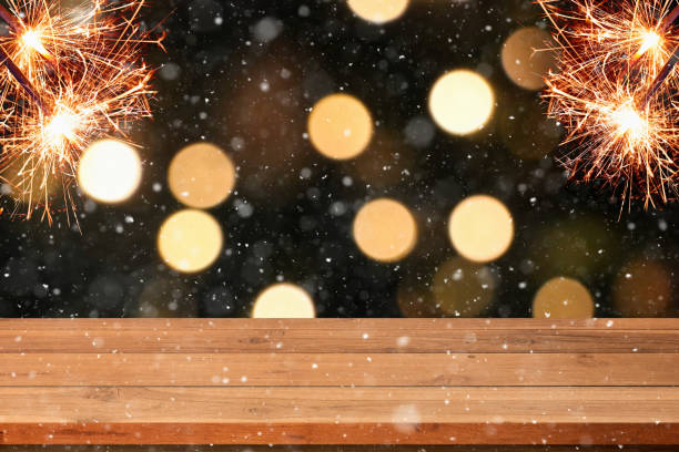 istock Abstract Snowy Christmas Background. Wooden Table With Defocused Lights. 3d illustration 1293198727