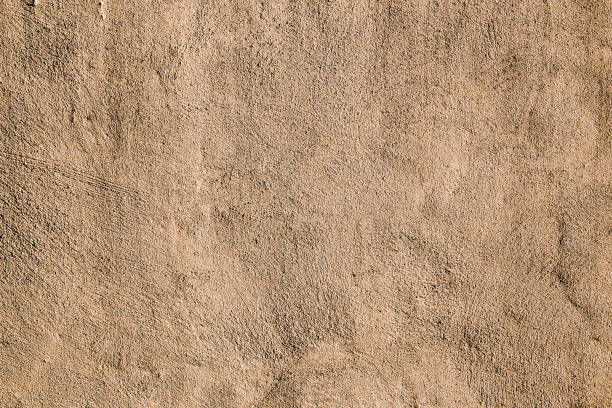 istock Beige colored abstract wall texture background in different shades of cream or beige 1293199657