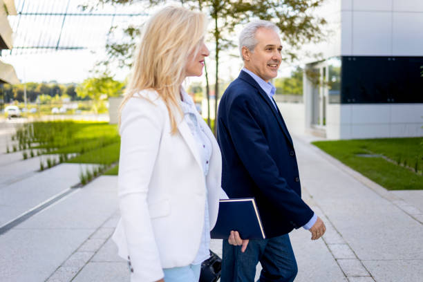 istock Two senior businessmen considering a business plan 1293200611