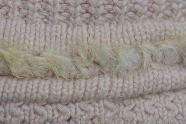 istock pink fabric texture of knitted woolen garment 1293205281