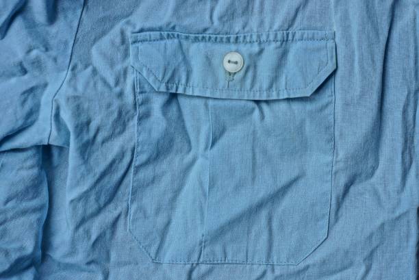 istock blue fabric texture from crumpled shirt with pocket 1293205930