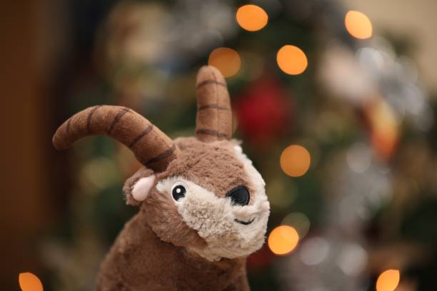 istock stuffed bouquetin in front of a Christmas tree 1293214757