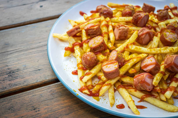 istock French fries with sausage, curry and ketchup 1293219287