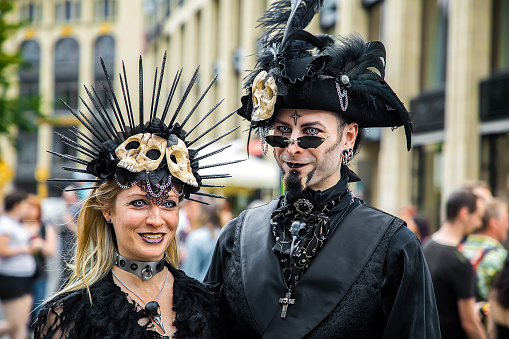 Leipzig, Germany , Juny 9, 2019 . Festive people in black and red gothic  and steampunk costumes at the street