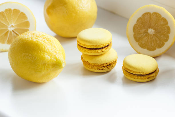 istock Yellow french macarons with lemons on the table 1293220446