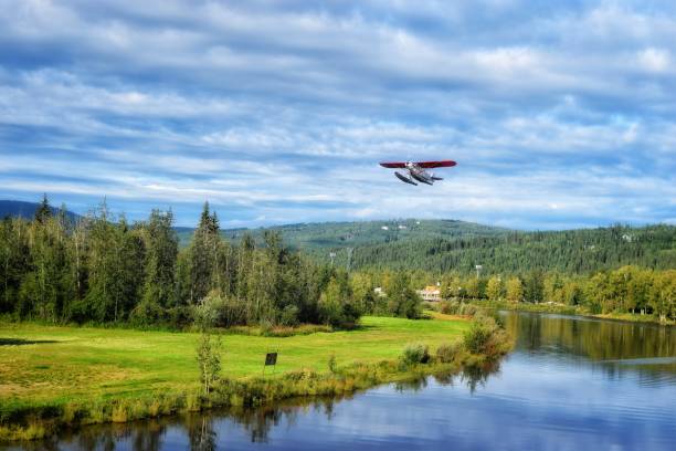 Bush plane in Alaska. Bush plane taking off on the China River in Alaska. kantor stock pictures, royalty-free photos & images