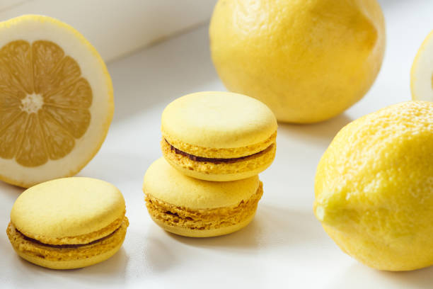 istock Yellow french macarons with lemons on the table 1293221095