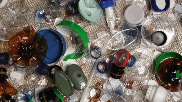 istock Plastic garbage from household on the table. Waste discarded, picked up from marine. City home trash made of plastic. Empty used bottles and cups create environmental pollution and ecological problem. 1293225537