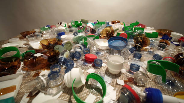 istock Plastic garbage from household on the table. Waste discarded, picked up from marine. City home trash made of plastic. Empty used bottles and cups create environmental pollution and ecological problem. 1293225598