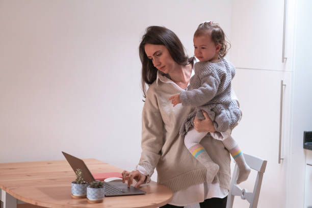 istock Young mother working at home with her daughter 1293227184