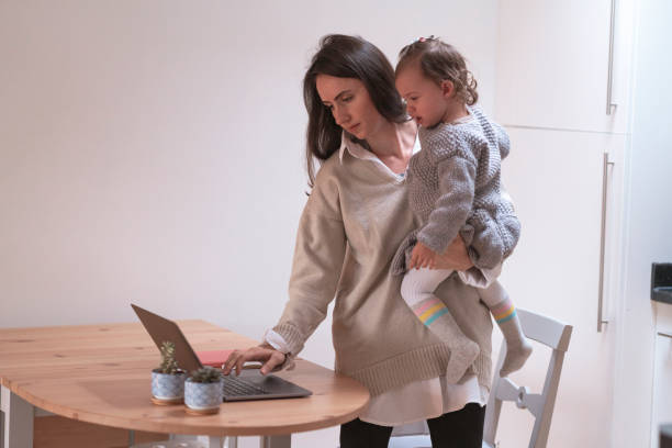 istock Young mother working at home with her daughter 1293227248