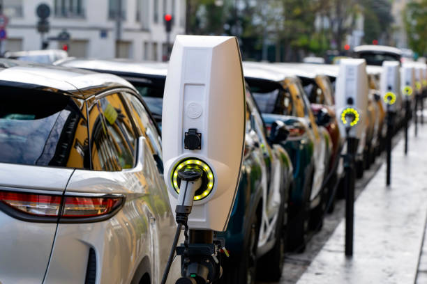 Public charging points on a street Paris, France - 13 November, 2019: Public charging points in a row on the street. The charging points are a popular view in European cities. electric car stock pictures, royalty-free photos & images